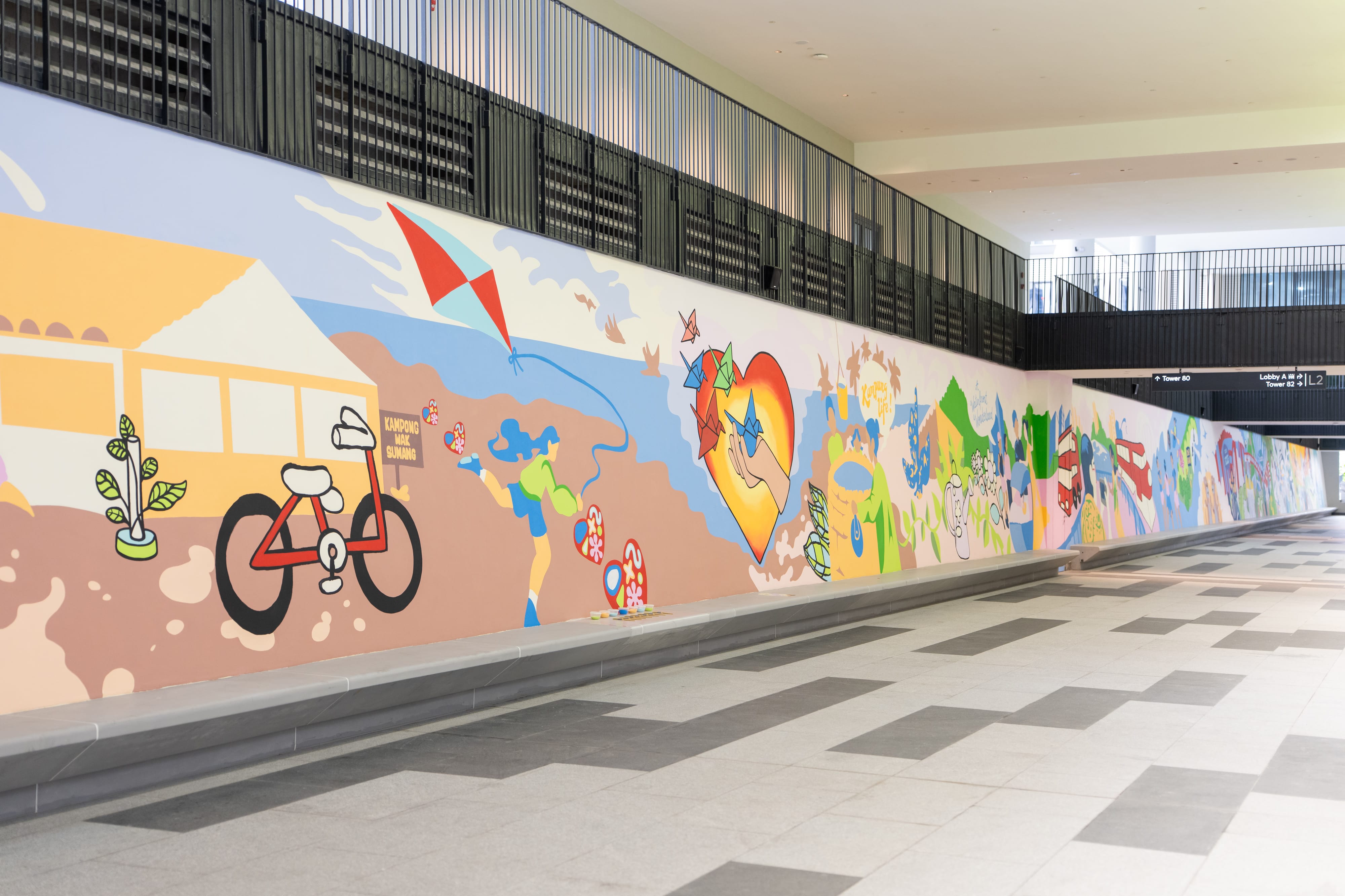 Wide shot of a mural wall with colourful artwork.